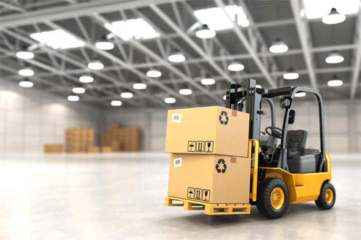 Forklift carrying boxes in a warehouse